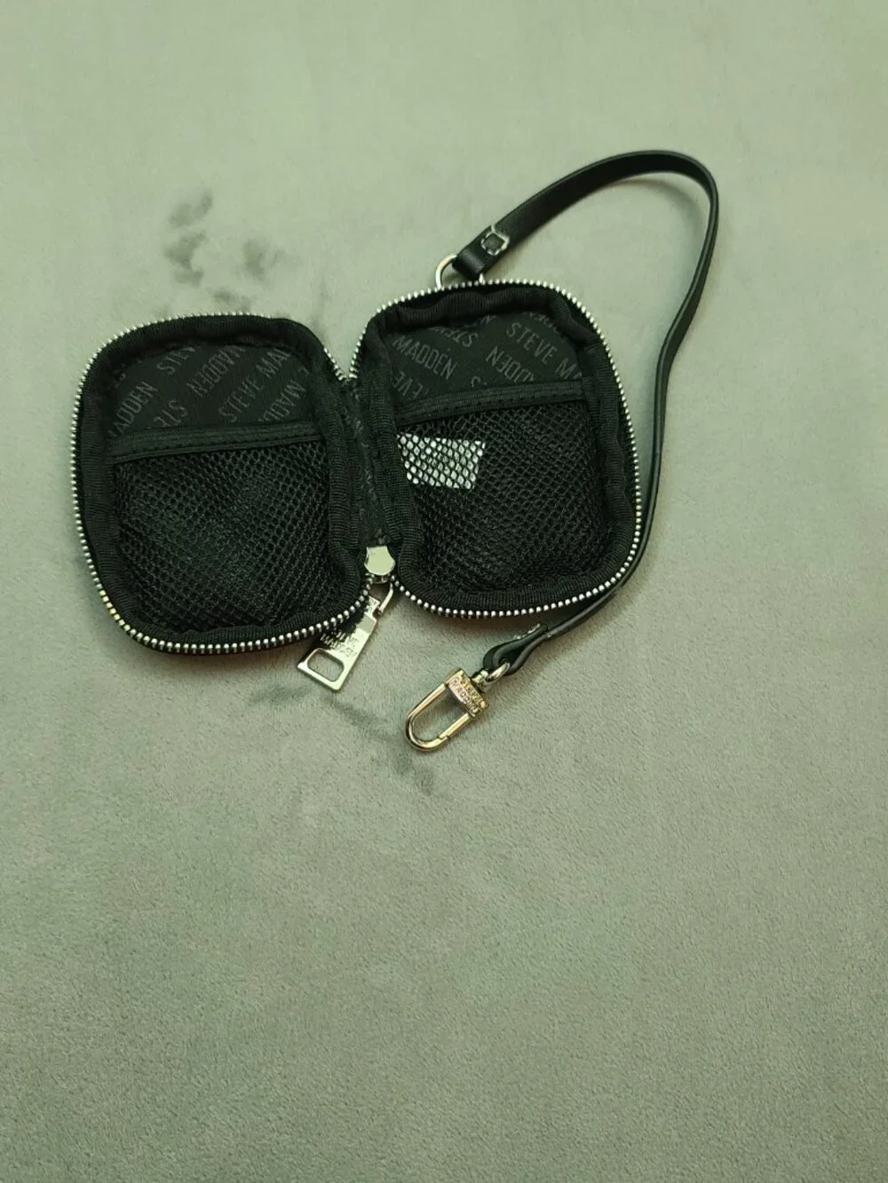 Authentic Steve Madden black textured faux leather mini zip-around pouch